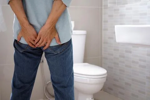 Men have diarrhea and are looking for shit. Stock Photos