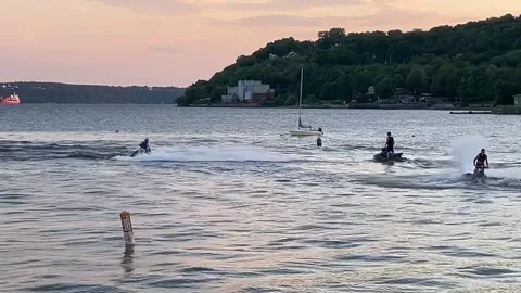 Men having fun on their jet skis Stock Footage 283268537
