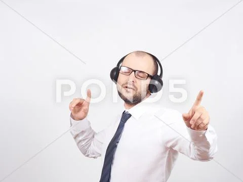 Men In Headphones Listens To Music And Sings.