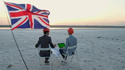 Men in helmets sit on chairs. Stock Footage 137948522