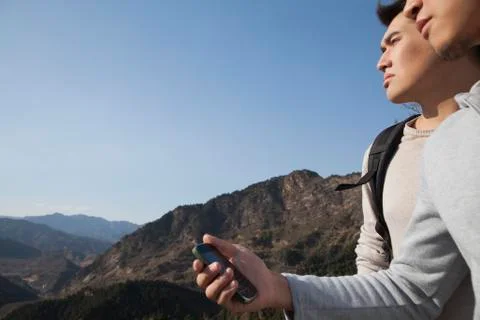 Men hiking and using GPS Stock Photos