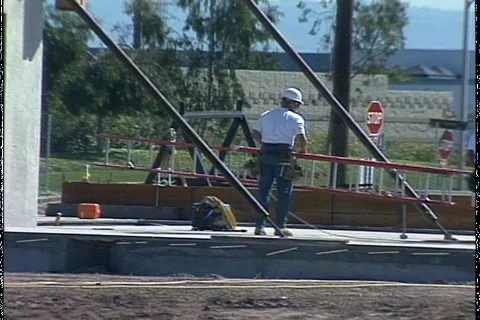 MEN HOISTING LADDER Stock Footage 1049661