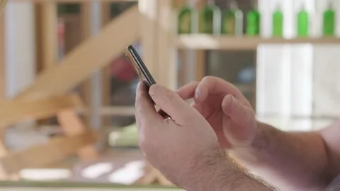 Men holding cell phone using smartphone device in a street cafe. Man blogger Stock Footage 219242635