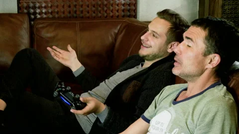 Men holding gamepad with both hands, having fun playing video game on console 4K 库存影片 109269513