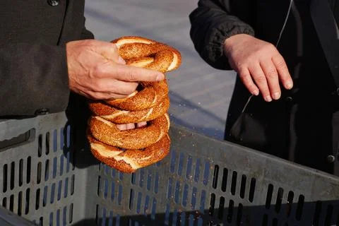 Men holding stack of Turkish Bagel Simit selling in a van Stock Photos