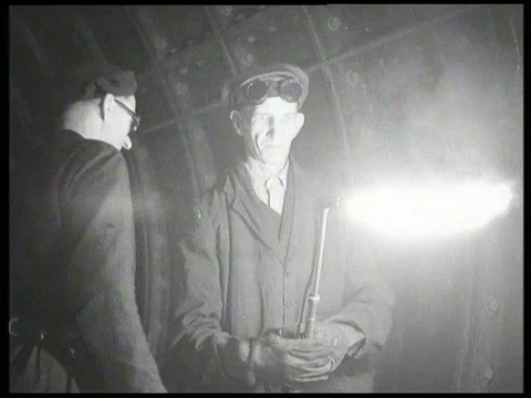 Men ignite oxy acetylene torch to repair broken rail in London metro, UK 1958 Stock Footage 136677596