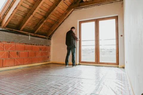 Men inside new house, construction site Stock Photos