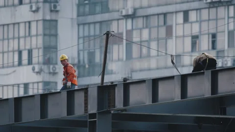 Men Inspect Building Frame on High Floor Stock Footage 224329088