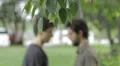 men kiss in the background - man gay - homosexuality HD Footage