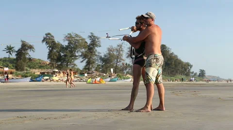 Men kiting at sandy beach in Goa. Stock Footage 49663480