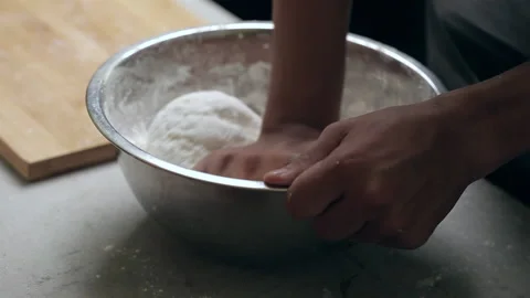 Men knead the dough to make bread. Bread Making Dough Knead. Stock Footage 152242820