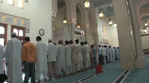 Men kneel to pray at Mosque Stock Footage 11140438