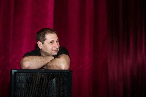 Men leans on the speaker Stock Photos