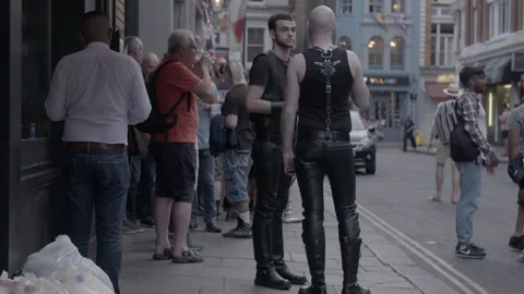 Men in Leather Outfits Chatting Outside Pub in Soho Stock Footage 344618948