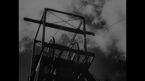 Men leaving coal mining shaft, taking shower and going home, Sheffield UK 1946 Video stock 133387653