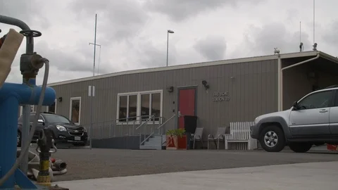 Men leaving the firehouse building Stock Footage 116472986