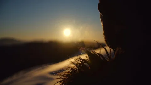 Men lets out steam in the cold, Carpathian mountains, Ukraine Stock Footage 127527821