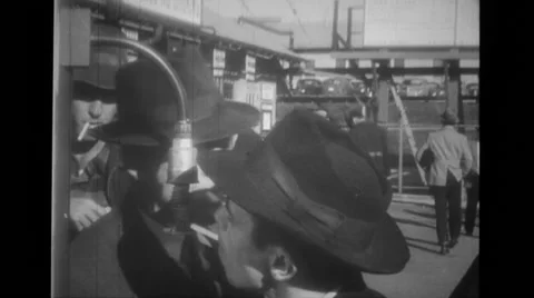 Men lighting  cigarettes on a public lighter Stock Footage 37593940