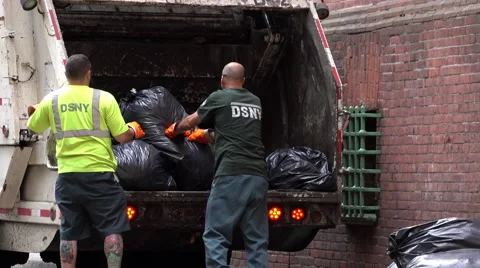 Men load garbage truck and compact trash 4k Stock Footage 68207424
