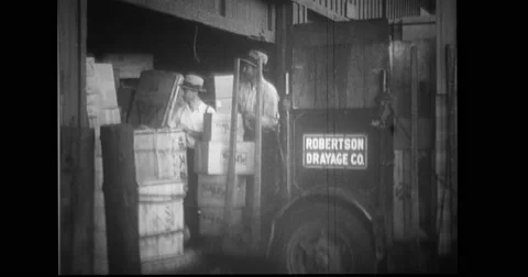 Men loading boxes after city life returns to normal Stock Footage