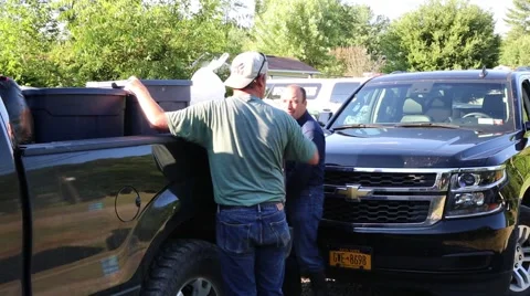 Men Loading Ice in Truck for Flood Victims Stock Footage 64903860