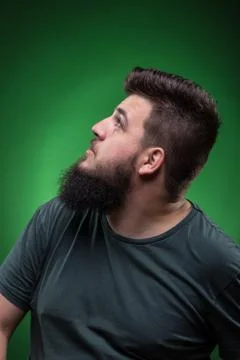 Men looking up to left. Green screen background. Stock Photos