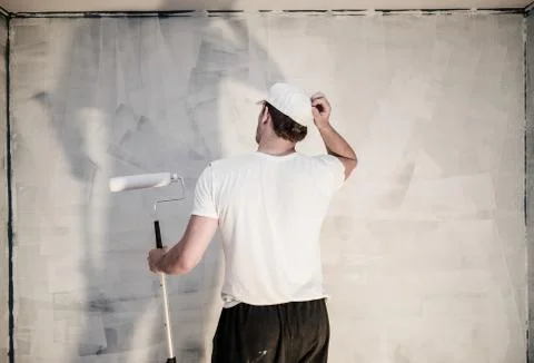 Men looking at the painted wall 写真素材