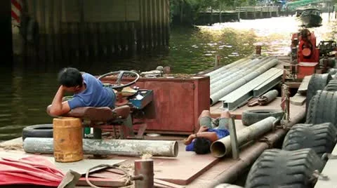 Men lying down on a boat Vidéo 10179688