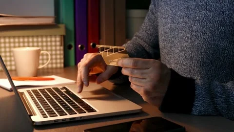 Men making purchase on laptop receiving cashback bank transaction or Stock Footage 265933461