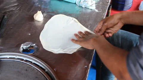Men making roti Stock Footage 46723122