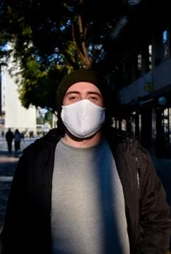 Men with a mask outside his home Stock Photos