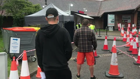 Men with Mask Waiting  in the Queue for Covid Certificates Covid Test Stock Footage 176623637