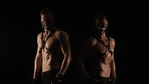 Men in masks is posing in a flashing light Stock Footage 86280585