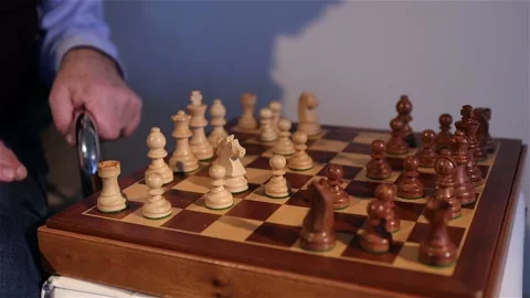 The men move the chessboard. Game of chess. Chess board close-up Stock Footage 167706101