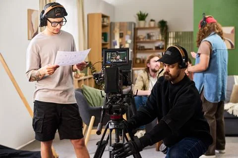 Men Operating Professional Video Camera on Film Studio Set Stock Photos