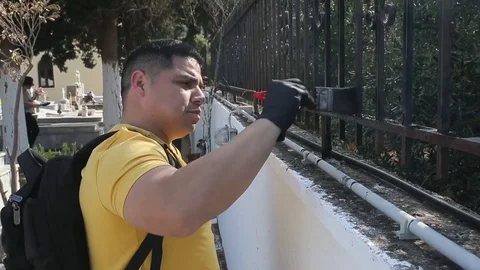 Men paint gate - 2018 Stock Footage 95552696