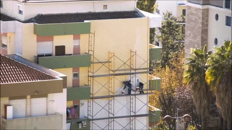 Men paint a wall for Christmas Stock Footage 69974272