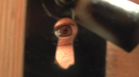 Men peeking through a keyhole. Vidéo 1266095