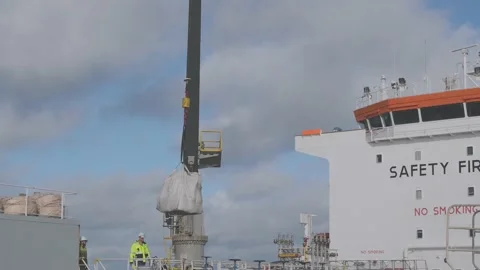 Men perform rigging operations with cargo on Rina tanker Stock-Footage 130994994