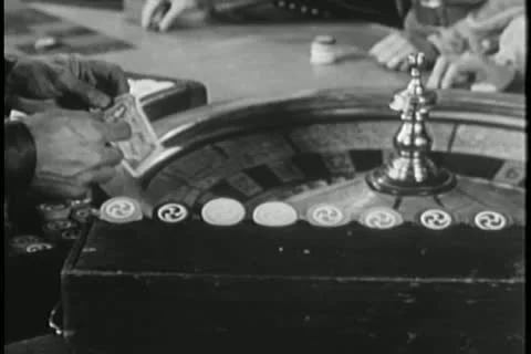 Men placing bet at roulette table Stock Footage 14521344