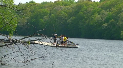 Men placing oars onto their scull Stock Footage 7900279