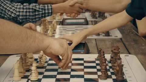 Men play chess with a clock in the Park Video stock 112935417