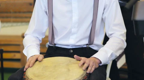 Men Play The Hand Drum Stock Footage 47980980