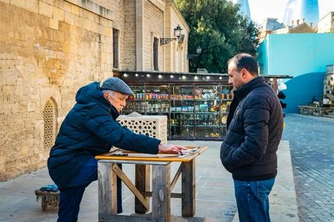 Men playing Backgammon Stock Photos