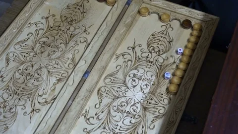 Men playing backgammon,wooden Board,roll the dice Видео 77926382