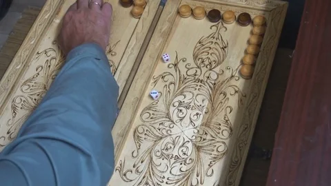 Men playing backgammon,wooden Board,roll the dice Stock Footage 77927481