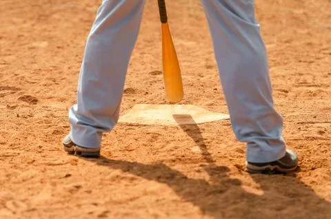 Men playing baseball game. Batter getting ready to hit a pitch during ballg.. Stock Photos