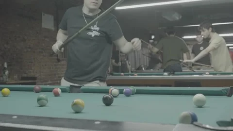 Men playing billiards in a billiards hall in Buenos Aires, Argentina Stock Footage 345142975