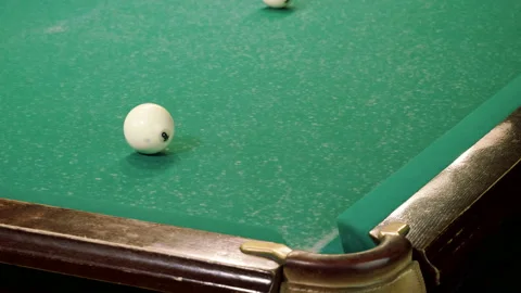Men playing billiards, hitting balls with cue into pockets on billiard table. 4K 库存影片 109452126