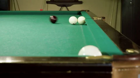 Men playing billiards, hitting balls with cue into pockets on billiard table. 4K 库存影片 109452661
